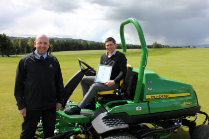 SRUC Elmwood Student of the Year Award 2015 winner Simon Dexter with John Deere dealer Sandy Armit of The Double A Trading Company Ltd