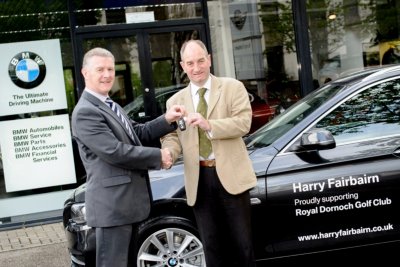 Iain Clark (left) hands the keys to Neil Hampton