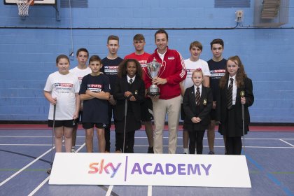 Nick Dougherty unveils the new British Masters trophy on a visit to The Buckingham School (Getty Images)
