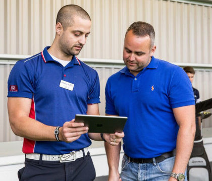 American Golf pro at work giving a lesson