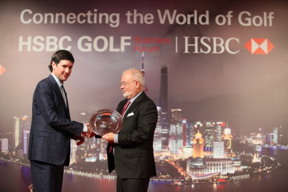 Bubba Watson makes the presentation to John Solheim