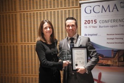 Manager of the Year Andrew Minty receives his trophy from previous winner Emma Clifford