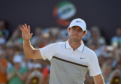 Rory McIlroy of Northern Ireland celebrates on the 18th green during the final round of the DP World Tour Championship on the Earth Course at Jumeirah Golf Estates on November 22, 2015 in Dubai, United Arab Emirates. (Photo by Ross Kinnaird/Getty Images)