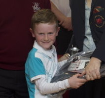 U8's winner George Ledsham gets his prizes from GUW Chair Dr Val Franklin and Mold club captain Don Farringdon
