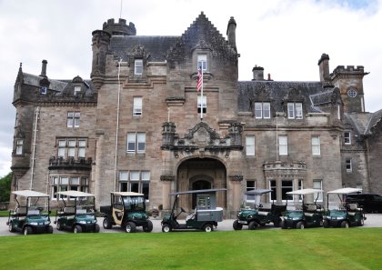 A selection of the vehicles in front of Skibo Castle, with the Cushman Refresher FS2 in the centre