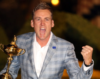 MEDINAH, IL - SEPTEMBER 30:  Ian Poulter of England celebrates with the Ryder Cup after the Singles Matches for The 39th Ryder Cup at Medinah Country Club on September 30, 2012 in Medinah, Illinois.  (Photo by Ross Kinnaird/Getty Images)
