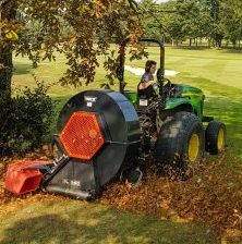 The Trilo BL960 clearing leaves from under the trees at Richmond Golf Club