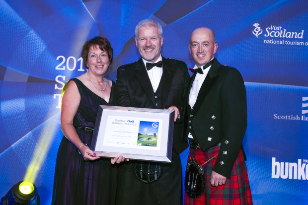 Pat Sawers, Chairman of the Carnoustie Golf Links Management Committee (left) and Sandy Reid, Links Superintendent at Carnoustie (right) receive award from Bunkered magazine’s Tom Lovering (centre)