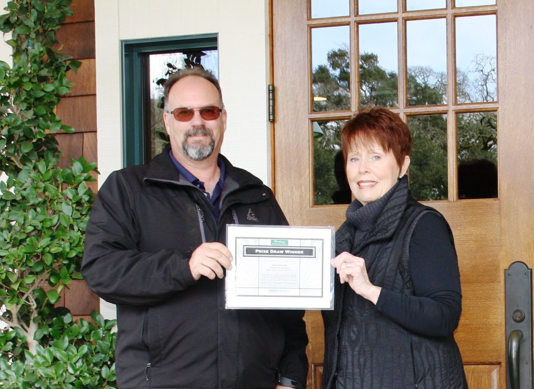 ClearWater prize draw winner Napa Valley Country Club's Assistant Superintendent Todd Schaublin receives the winner's certificate from Human Resource Manager Marsha Lujano