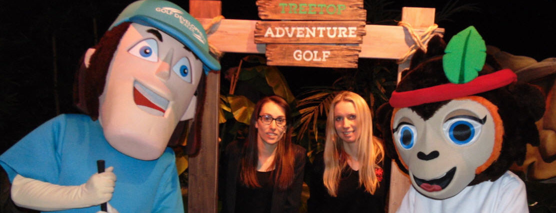 The Golf Development Wales Mascot and Treetop Adventure Mascot Simi the monkey with Lydia Hutton (left) Marketing, PR & Events Manager Treetop Adventure Golf, and Hannah McAllister, Golf Union of Wales director of development, at Treetop Adventure in Cardiff