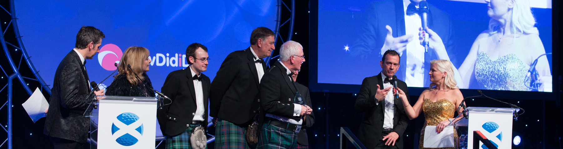 Representatives from Muir of Ord Golf Club on stage to accept their award (Pic Kenny Smith)