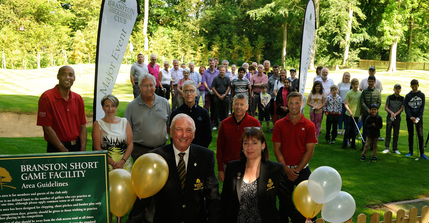 Robert Sanders, Branston Club president, & lady captain Charlotte Barker supported by PGA professionals, junior golfers and many members at the opening of the new Short Game facility at Branston Golf & Country Club