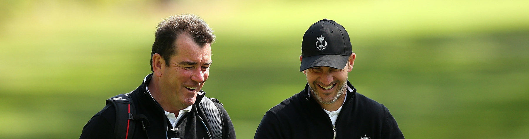 OTTERSHAW, ENGLAND - SEPTEMBER 13:  Cameron Clark, Vice Captain of the Great Britain and Ireland PGA Cup shares a joke with Albert MacKenzie, Captain of the Great Britain and Ireland PGA Cup team during a practise round ahead of the 28th PGA Cup at Foxhills Golf Course on September 13, 2017 in Ottershaw, England.  (Photo by Jan Kruger/Getty Images)