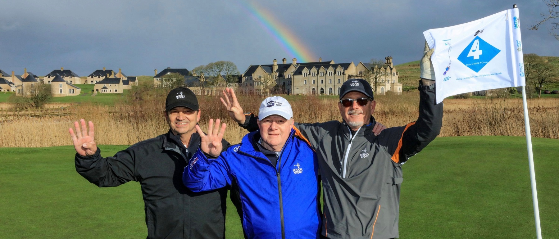ENNISKILLEN, NORTHERN IRELAND - MARCH 02: Nick Edmund of England poses for a photograph with Jeff Mahan of the United States (L) and Mark Ward of the United States (R) owners of the Lough Erne Resort on the par 5, fourth hole with the special GlobalGolf4Cancer pin flag at the start of his GlobalGolf4Cancer Northern Ireland Golf-Walk at the Lough Erne Resort on March 02, 2019 in Enniskillen, Northern Ireland. (Photo by David Cannon/Getty Images)