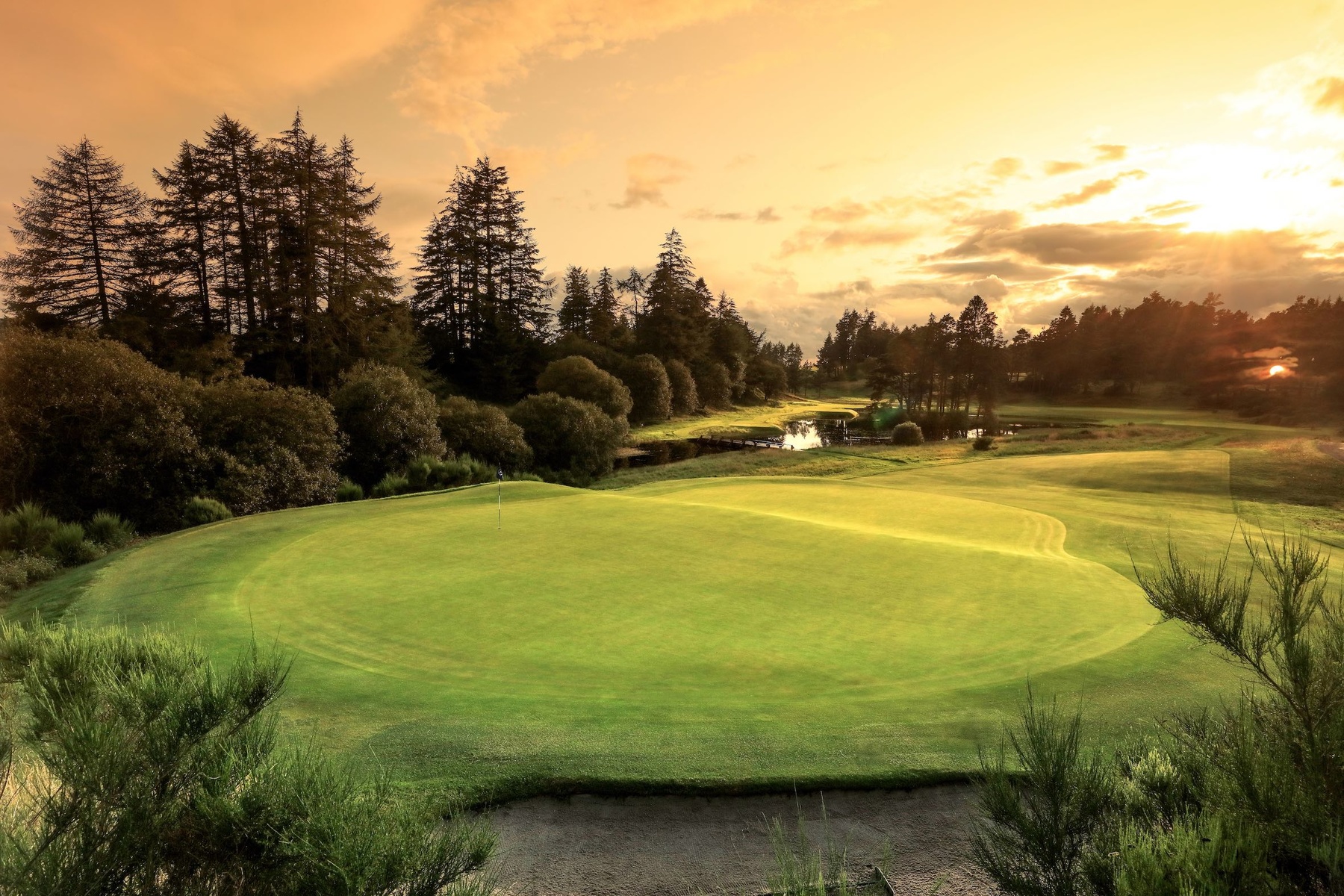 AUCHTERARDER, SCOTLAND - AUGUST 12: EDITORS NOTE: Graduated colour filter used on the sky of this image; A view from behind the green on the par 3, 14th hole showing the recently constructed new tees to the left side of the picture on the Queen's Course at Gleneagles on August 12, 2019 in Auchterarder, Scotland. (Photo by David Cannon/Getty Images)