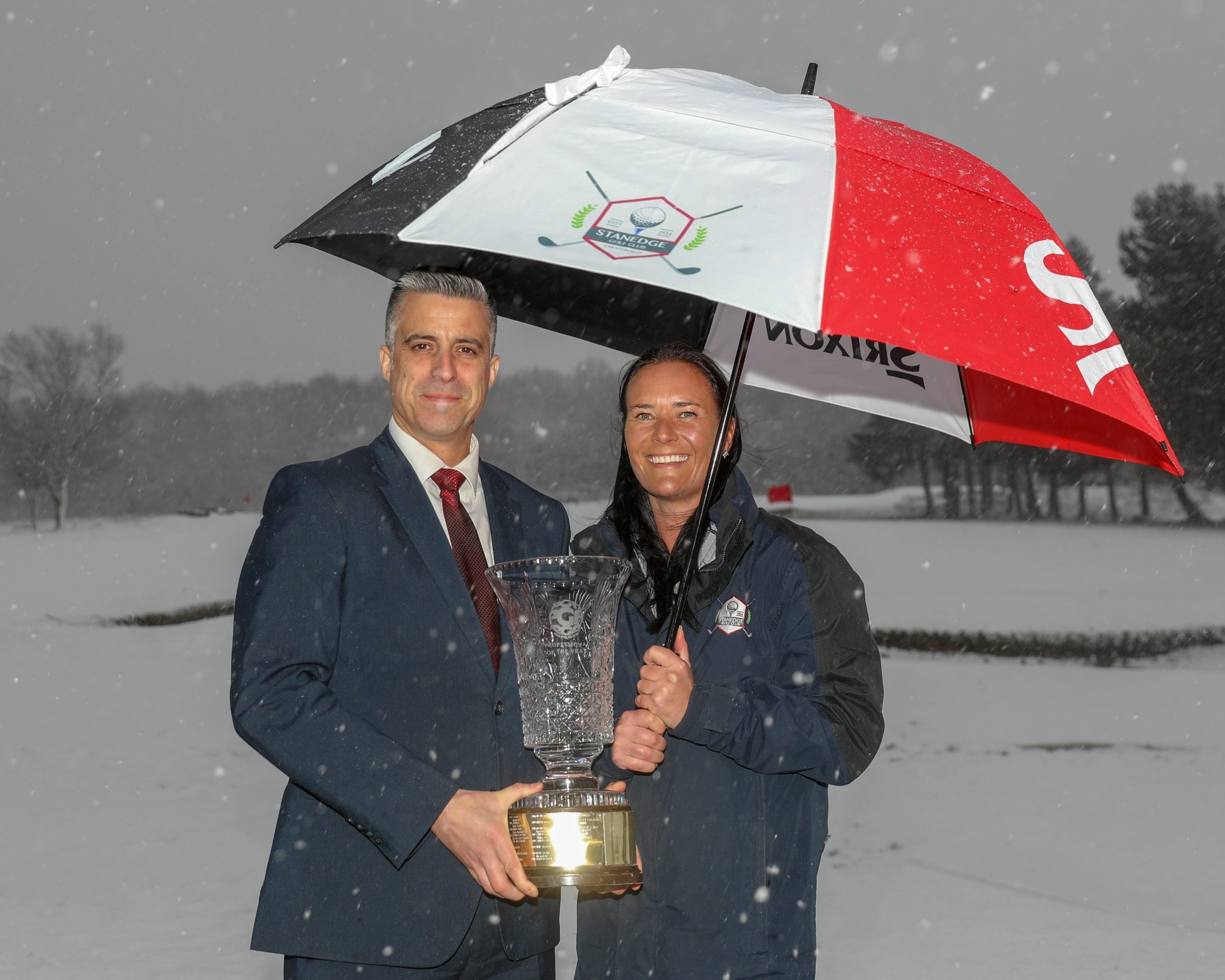 Fame Tate receives the PGA Midlands Professional of the Year Award from regional manager James Brown (picture by Adrian Milledge)