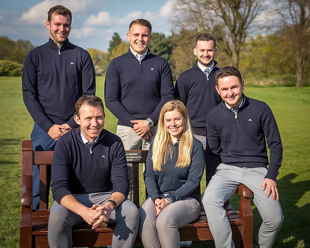 Dean (seated left) with his team