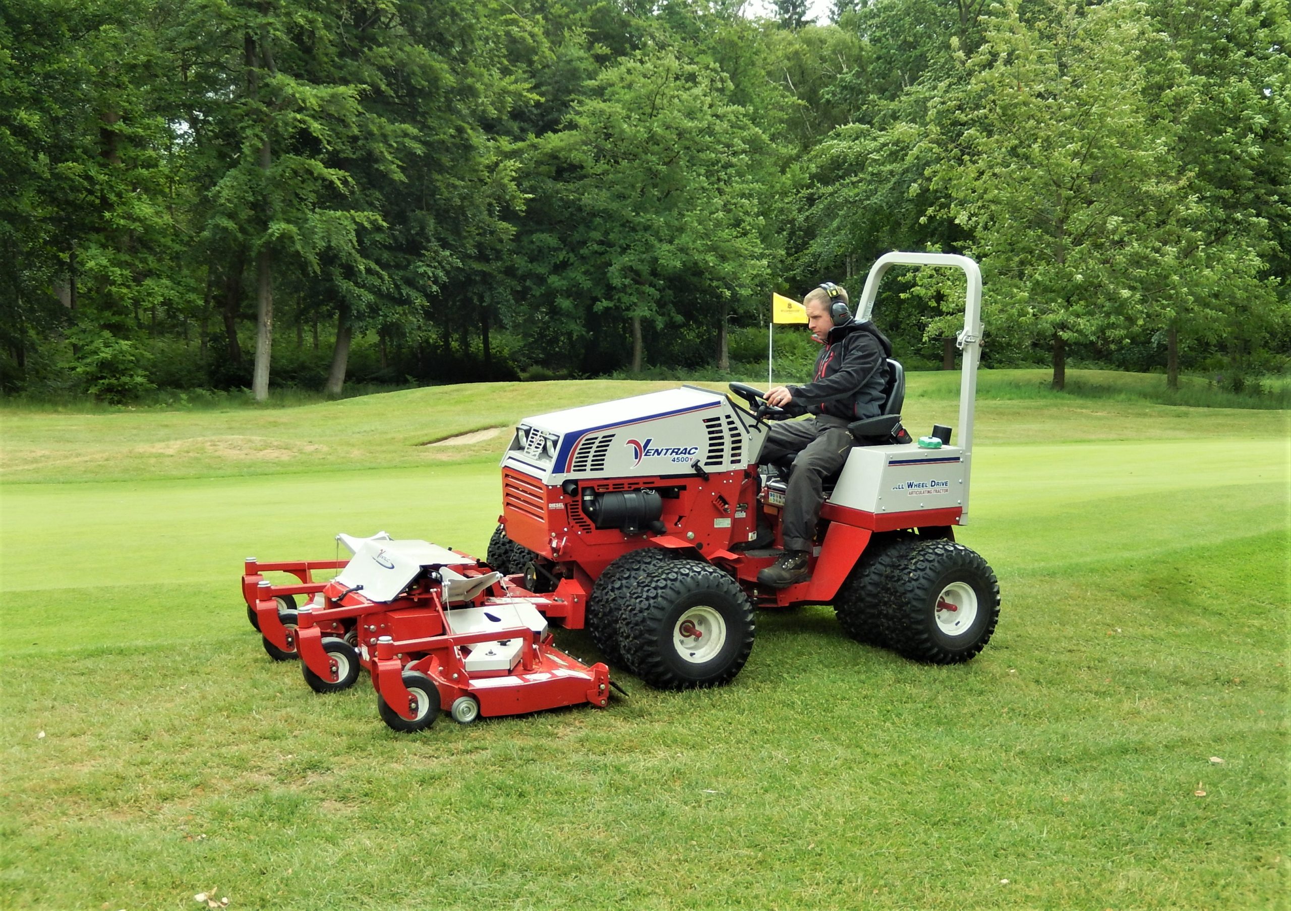 Deputy Course Manager, Lee Austin, mowing greens surrounds on the 18th at The Wildernesse