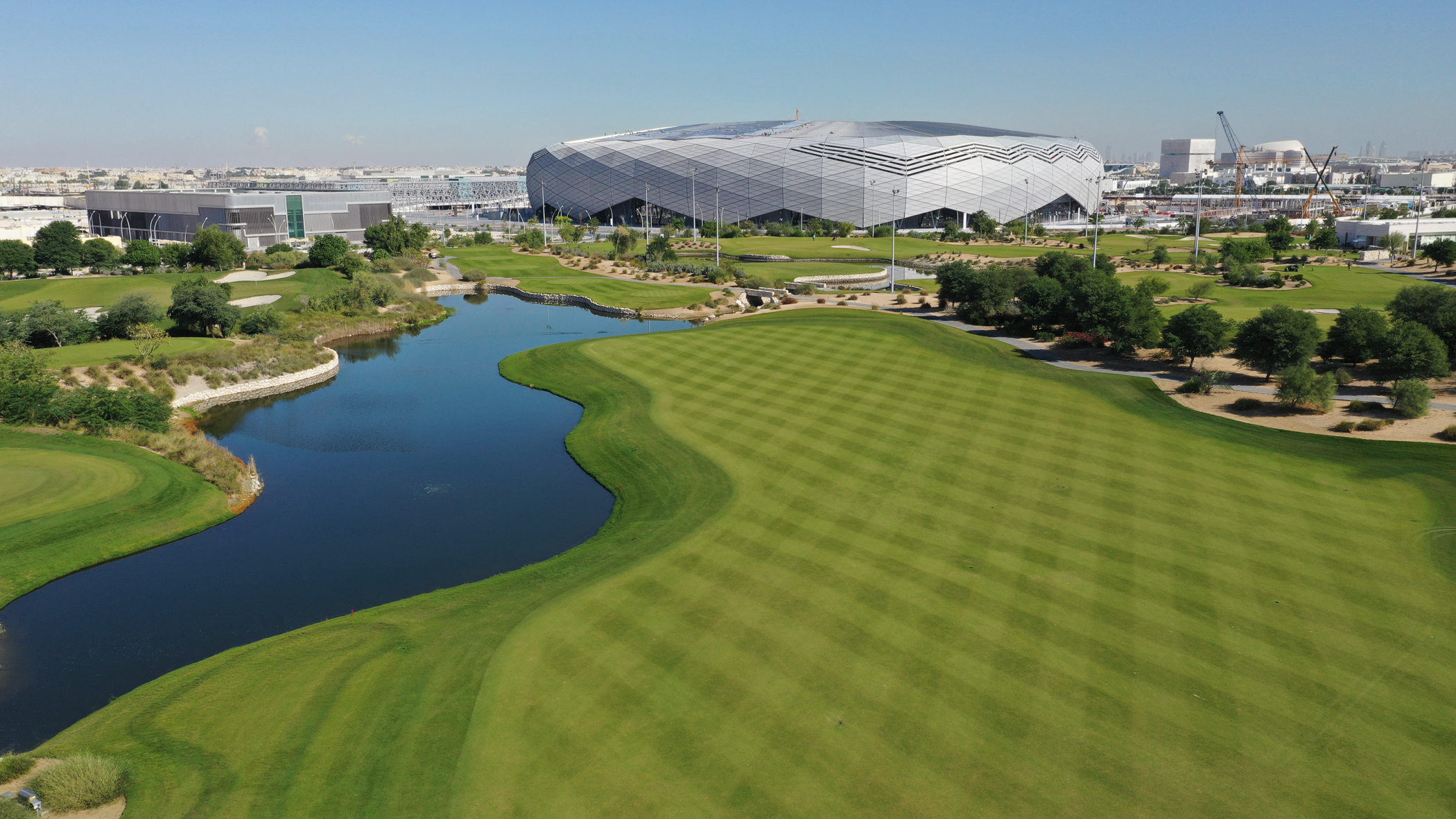 A view over the Education City golf course, with the 2022 FIFA World Cup Education City Stadium in the background