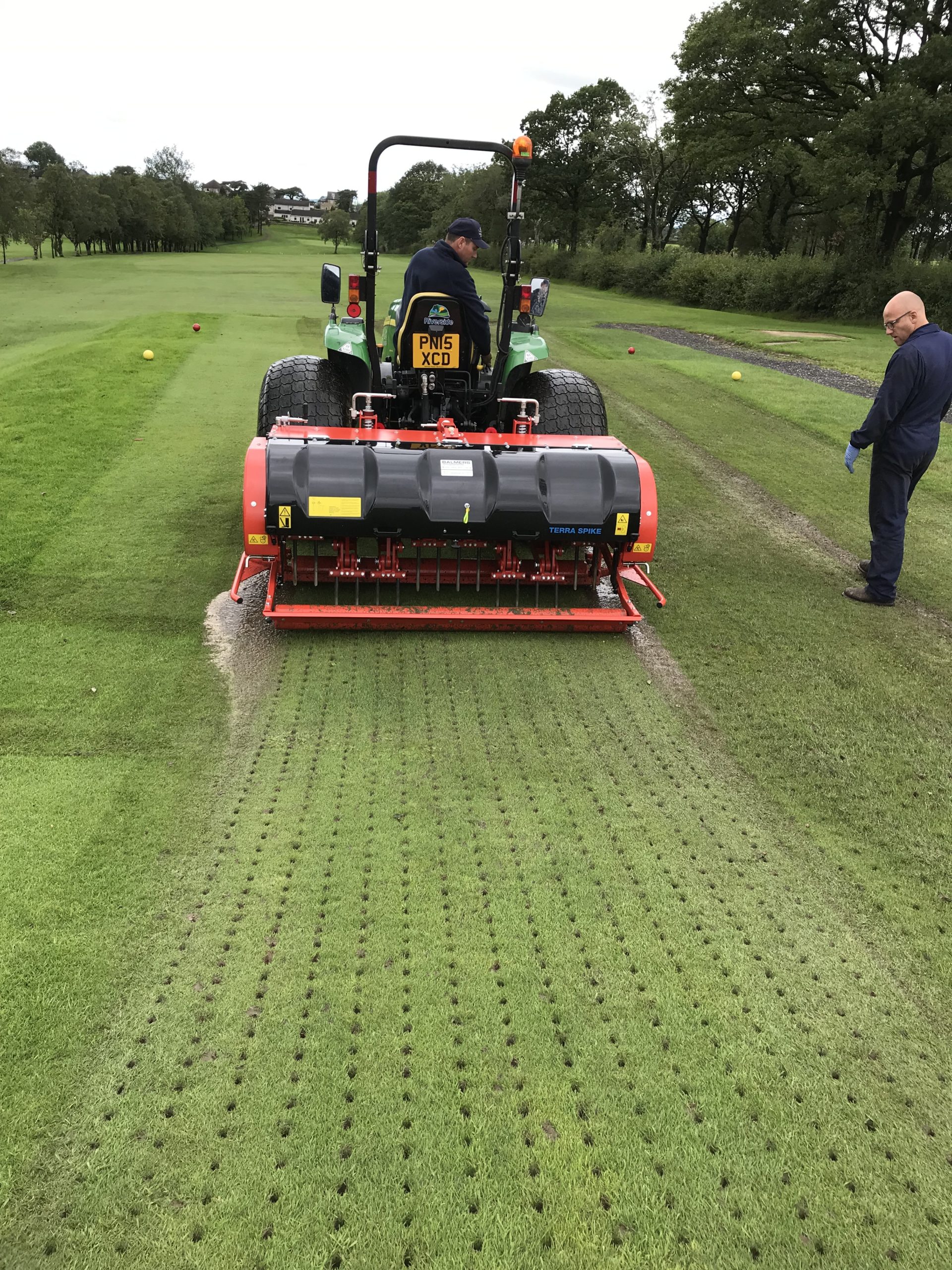 Bentham’s Shaun Conway, driving, and Wiedenmann UK’s Andy Kerr, right, discuss  the in cab operations