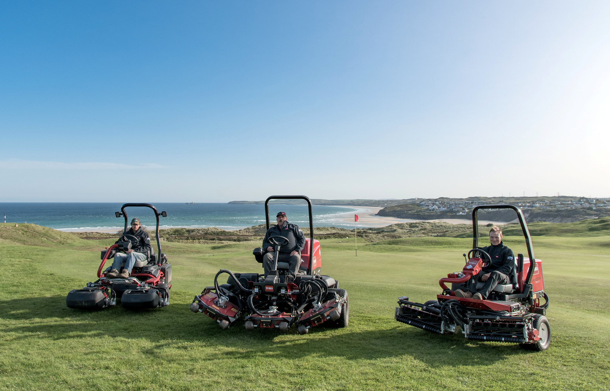 From left: greenkeepers Matt Jones, Stephen Elliot and Martin Lenny on the Toro machines purchased by West Cornwall Golf Club