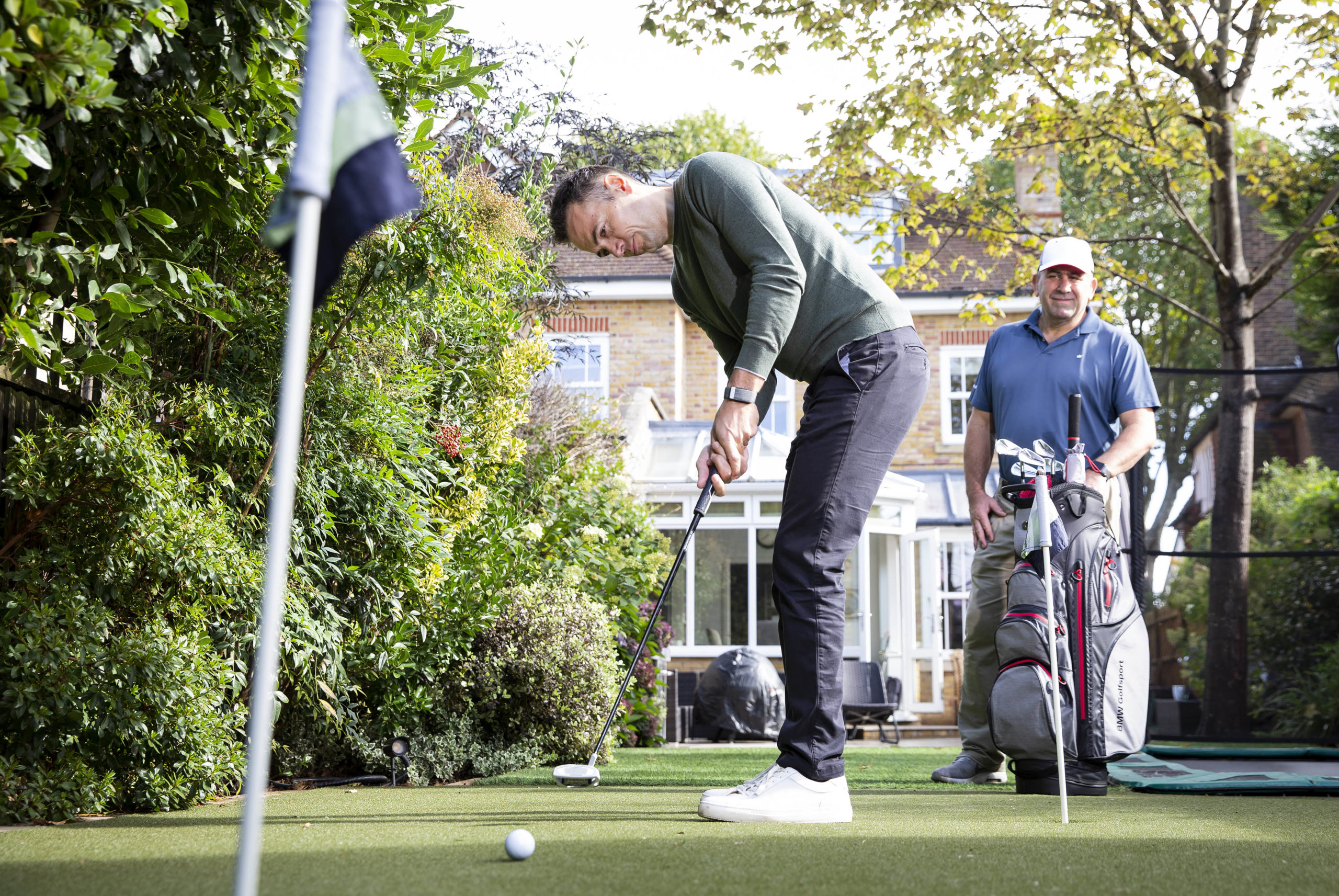 Nick Dougherty checks out John Simpson's homemade back garden course in London (photo by Matt Alexander/PA Wire)