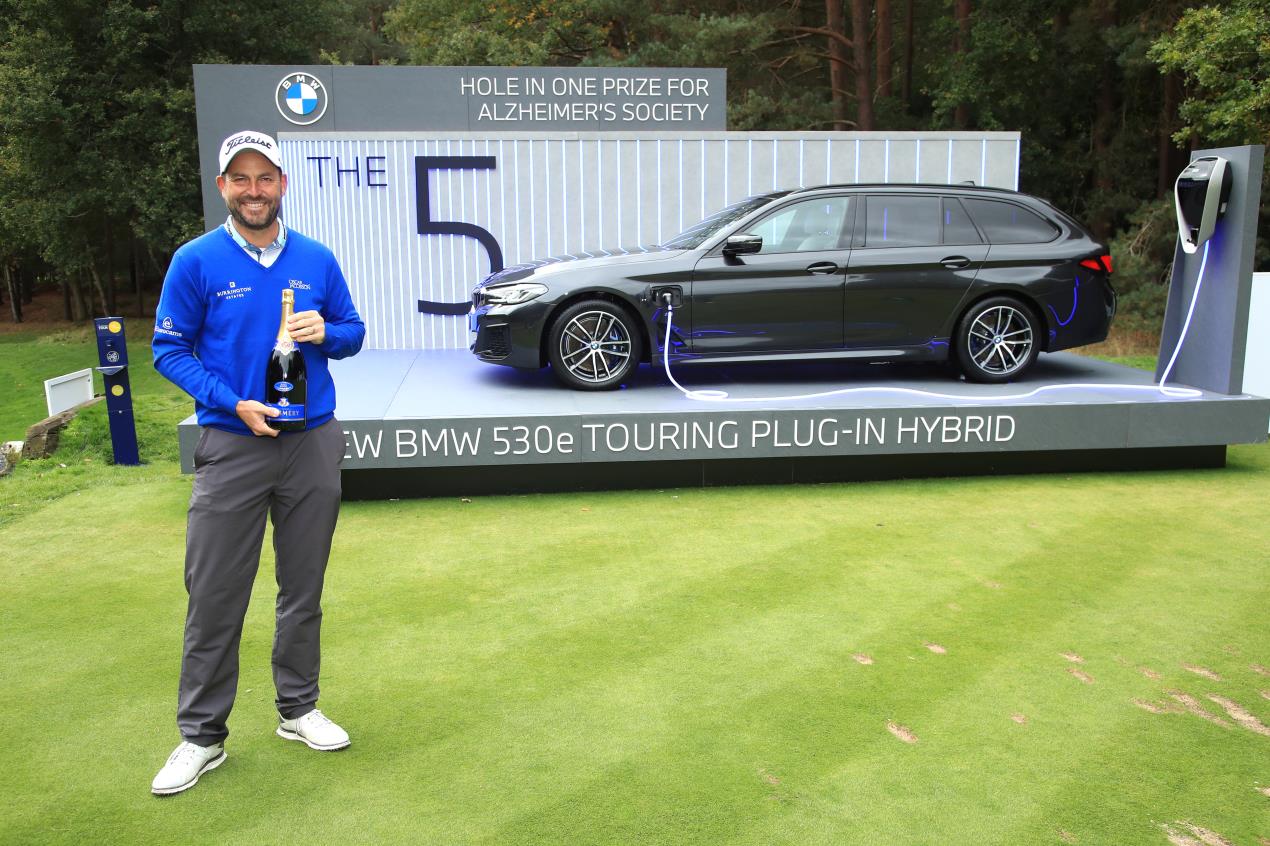 David Howell's ace at the par-3 14th earned him a bottle of Champagne and a £71,675 donation to the Alzheimer’s Society from sponsors BMW