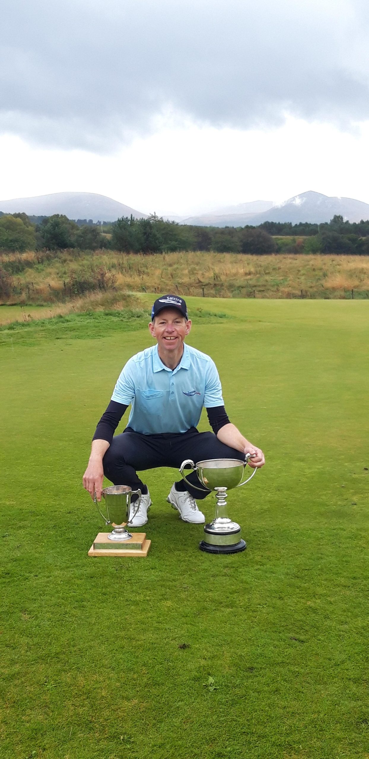 Ross Cameron with the Scottish PGA Championship trophy and the Northern Open trophy (left)