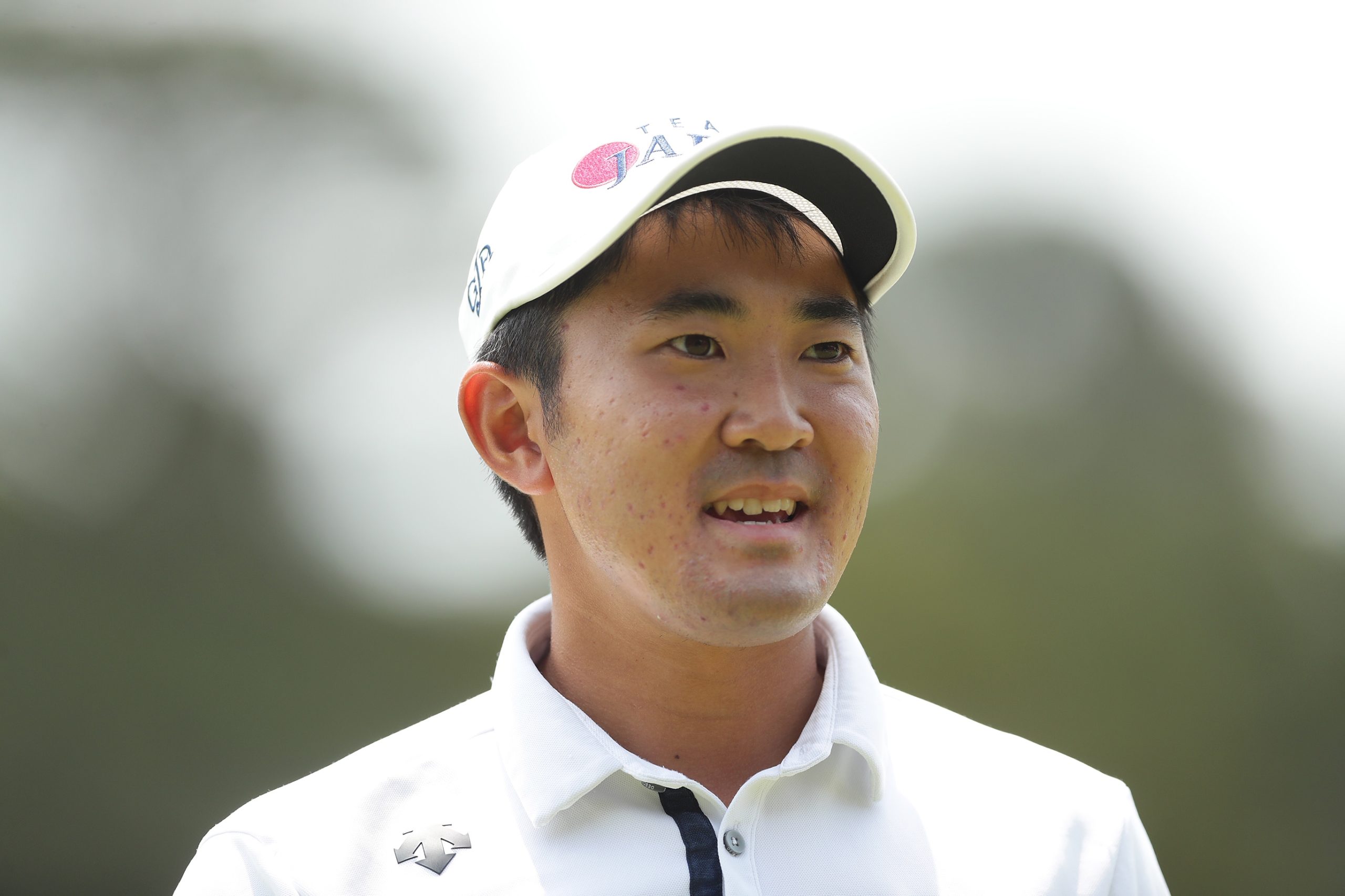 SYDNEY, AUSTRALIA - DECEMBER 08: Takumi Kanaya of Japan acknowledges the crowd after putting on the 7th hole during day four of the 2019 Australian Golf Open at The Australian Golf Club on December 08, 2019 in Sydney, Australia. (Photo by Mark Metcalfe/Getty Images)