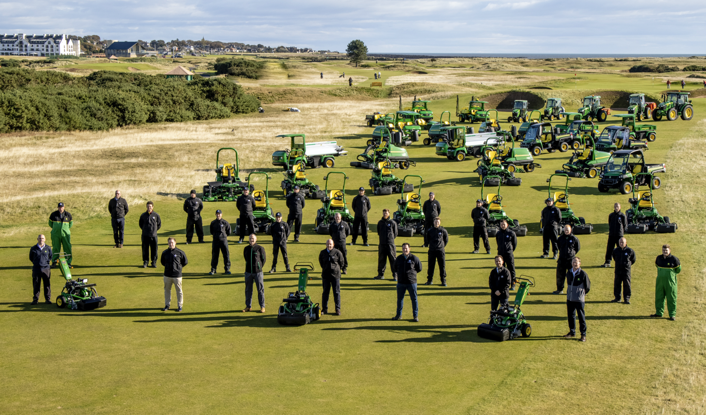 Carnoustie Golf Links, Rain Bird, John Deere and dealer Double A staff with some of the new machinery fleet on the 14th fairway of The Championship Course