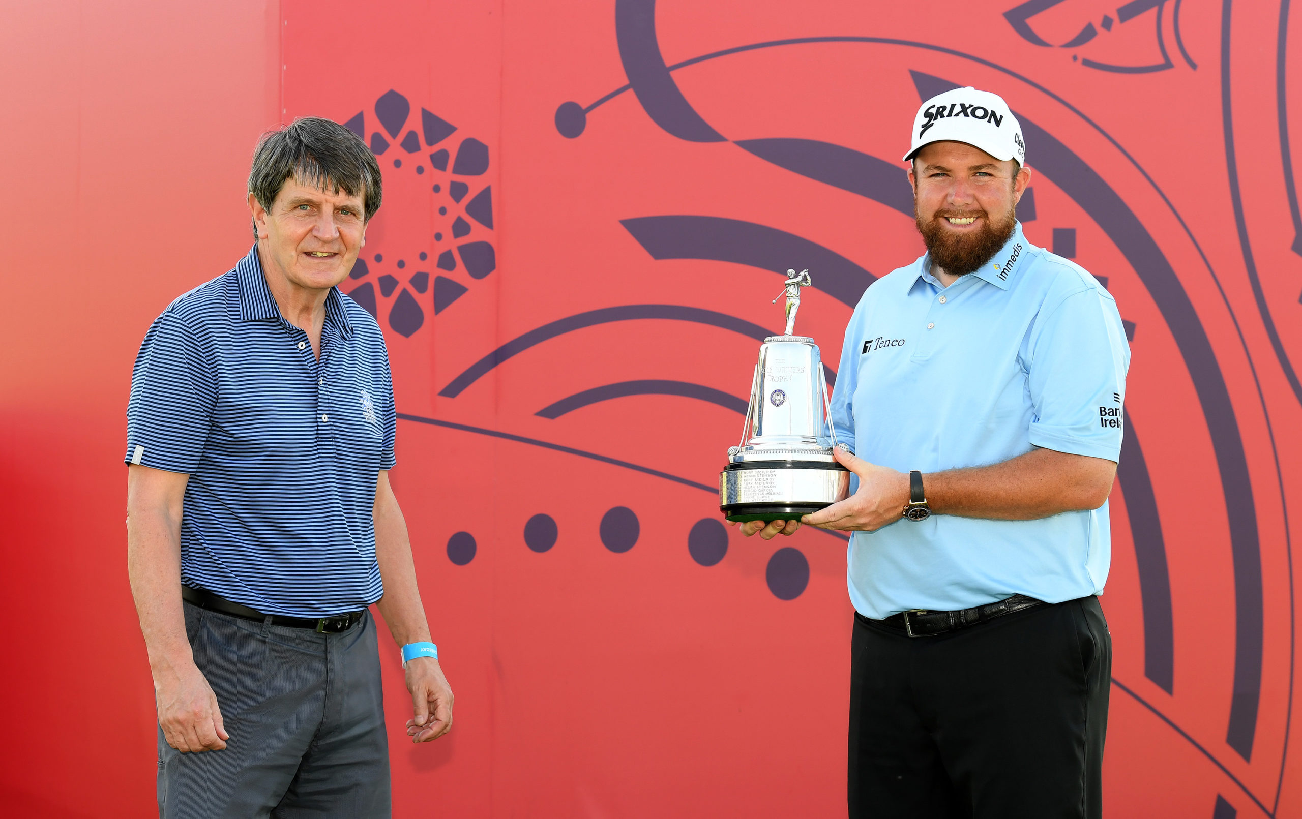 Shane Lowry receives the AGW Golf Writers Trophy from AGW committee member David Facey (pic Getty Images)