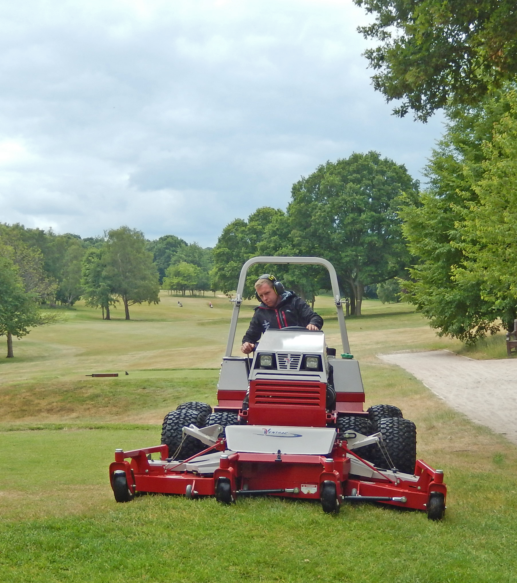 Deputy Course Manager, Lee Austin, mowing tee surrounds at The Wildernesse