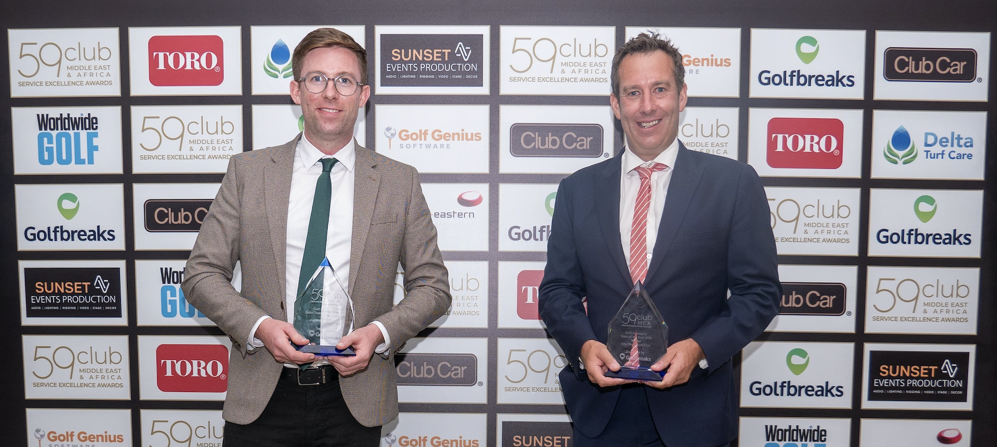 Scott Sellars, Golf Operations Manager of Abu Dhabi Golf Club and Clinton Southorn, Cluster Director of Agronomy celebrate the club's double award