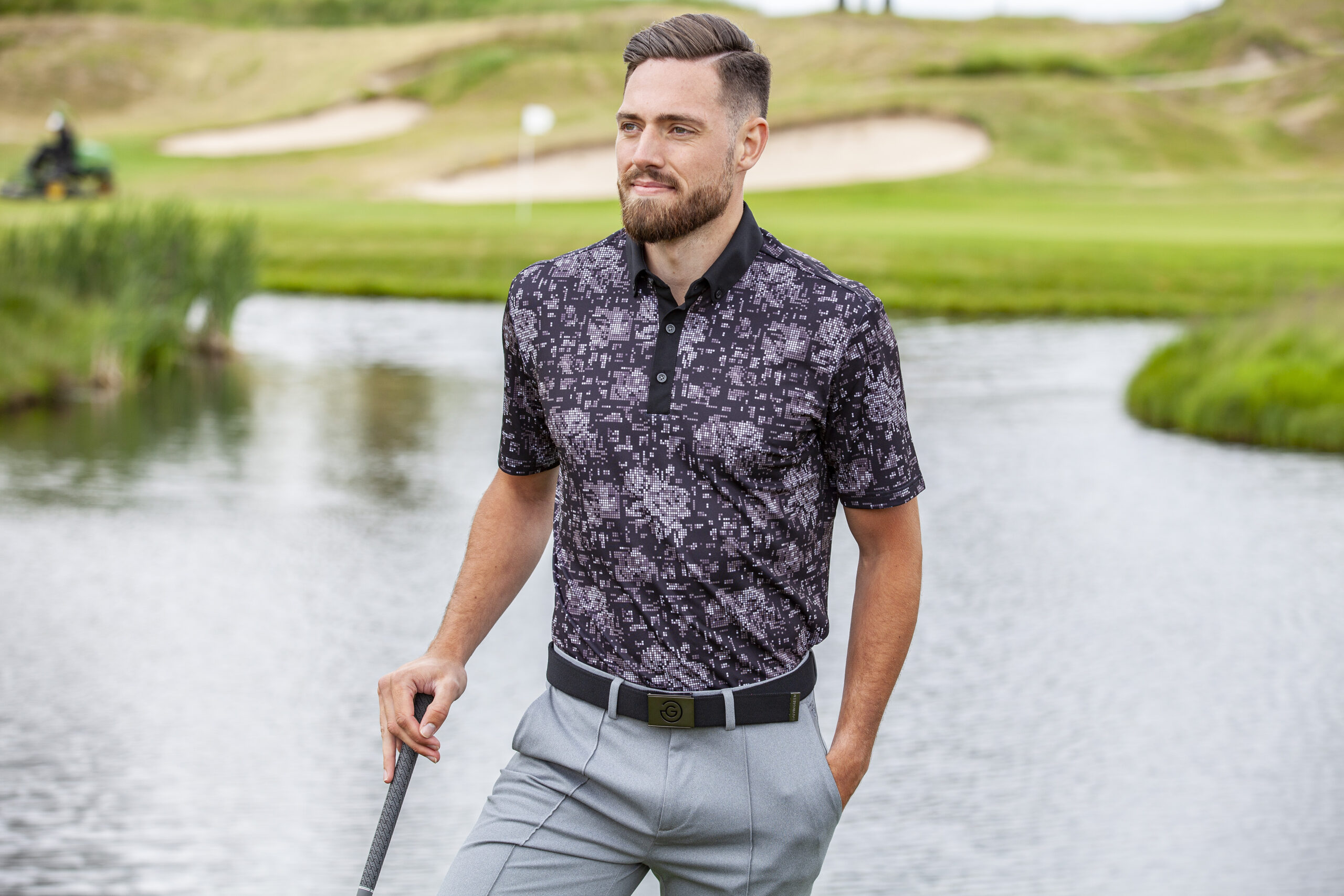 The Maddox polo features a pixelated print