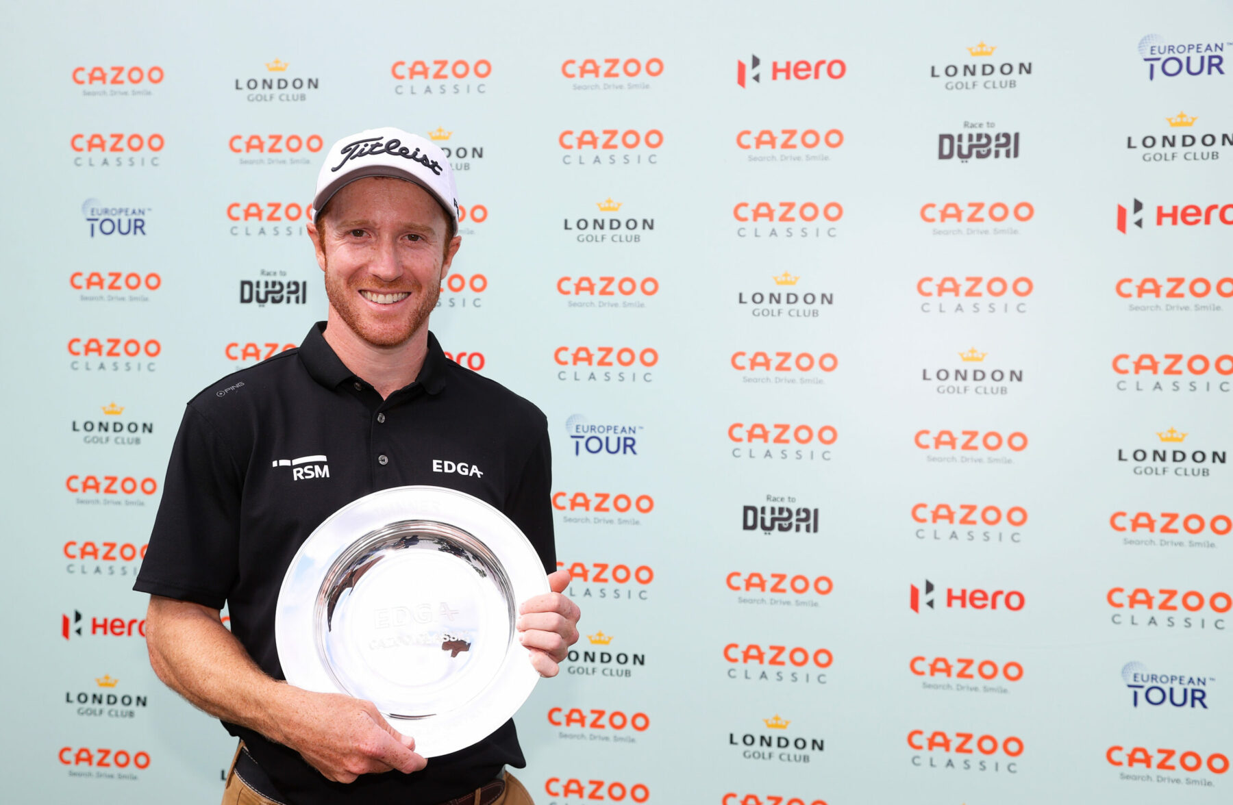 Chris Biggins of England poses with the trophy following the Final Round of the EDGA Cazoo Classic at the London Golf Club (Photo by Andrew Redington/Getty Images)