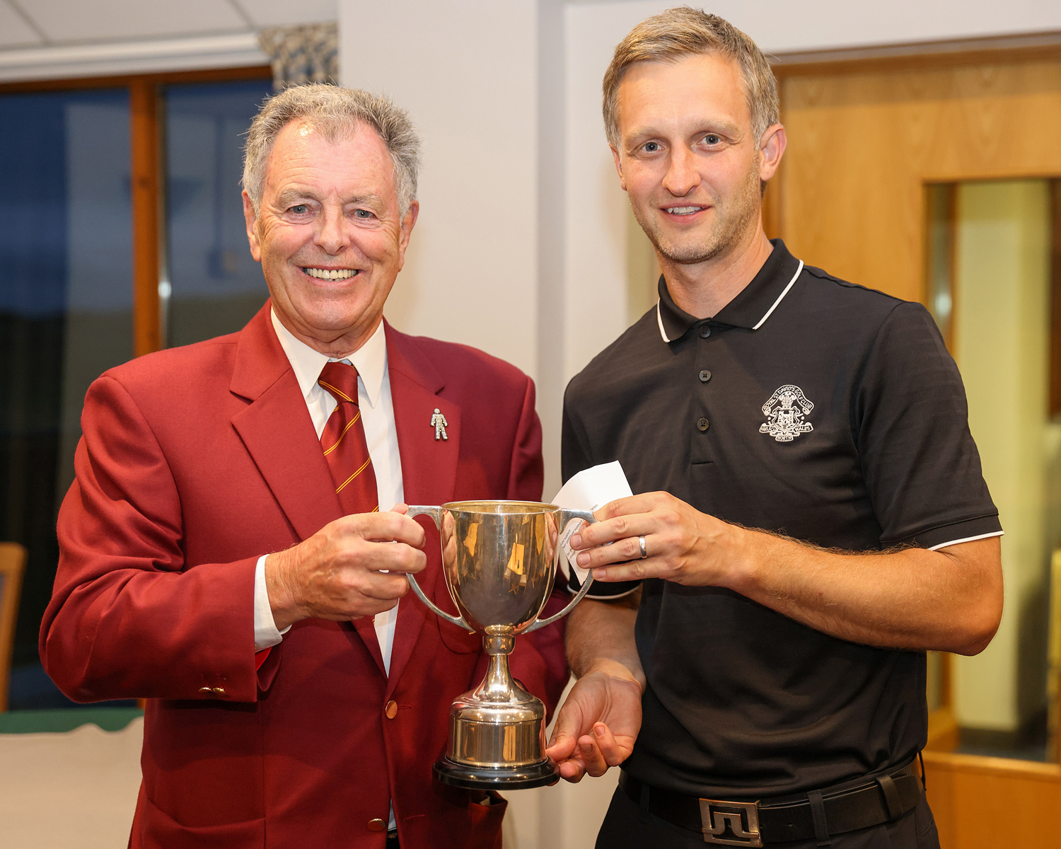 Bernard Gallagher presents the Welsh National PGA Championship trophy to Lee Rooke