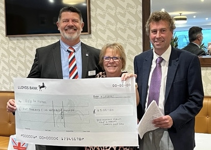 John Carpenter, left, Help for Heroes' area fundraising manager (south), receives a cheque from Vicky and Richard Hart, organisers of the fundraising golf day