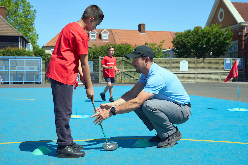 Chris Jenkins, PGA Advanced Professional of Crowlands Golf Centre near Dagenham pictured at Valence Primary School, Dagenham, presenting golf to the youngsters for the first time.  