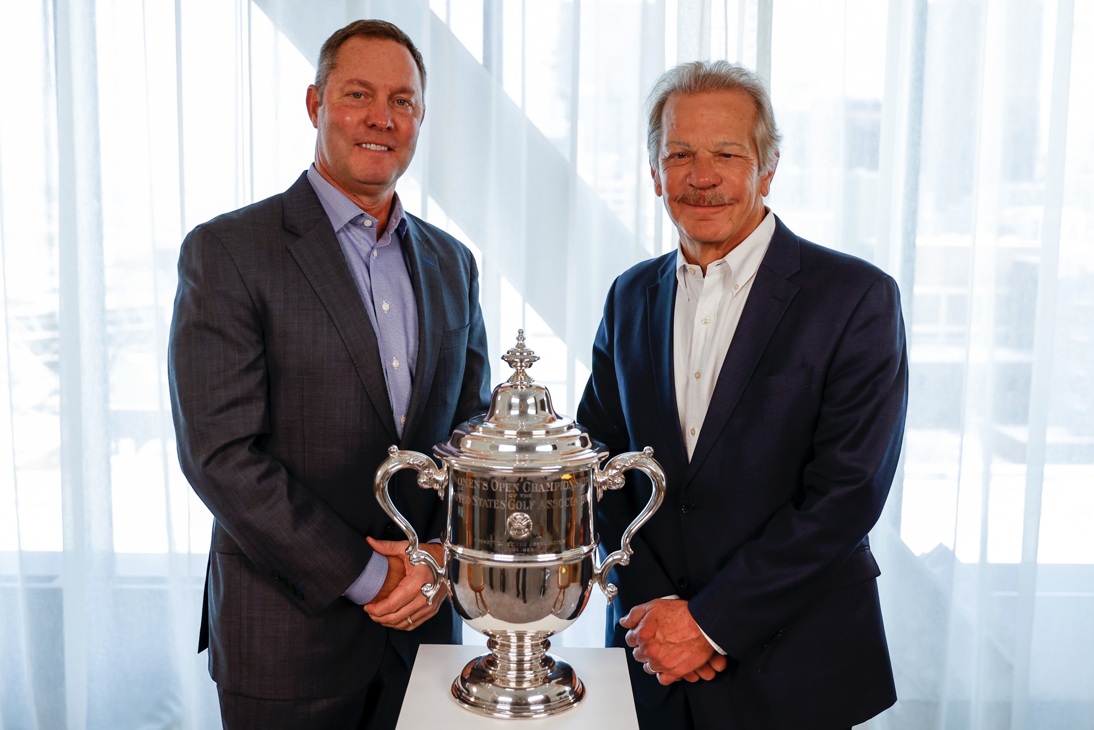 USGA CEO Mike Whan (left) and Randy Oostra, ProMedica's President &amp; CEO