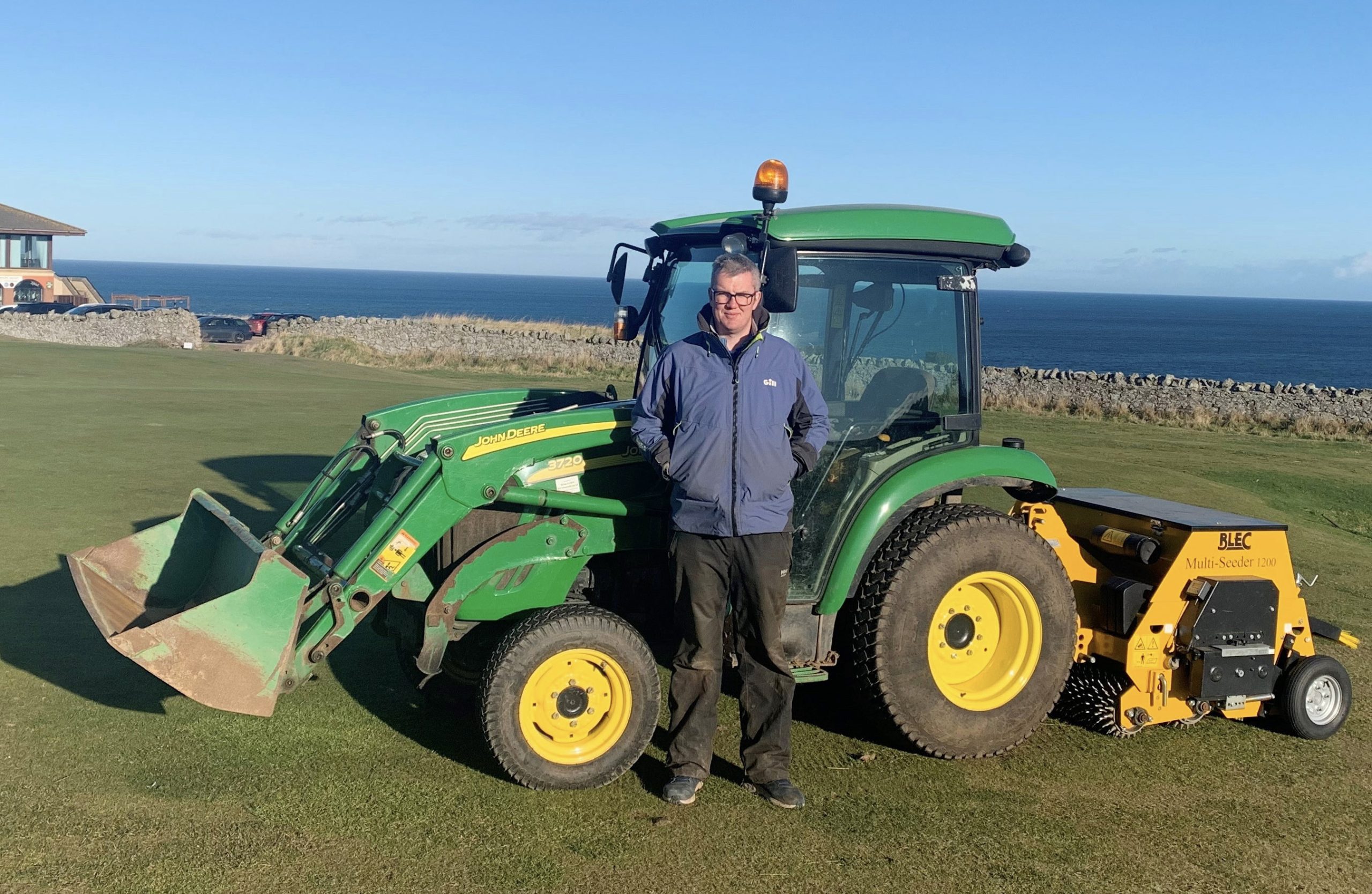 Eyemouth head greenskeeper Keith Burgon with his Redexim  Multi-Seeder 