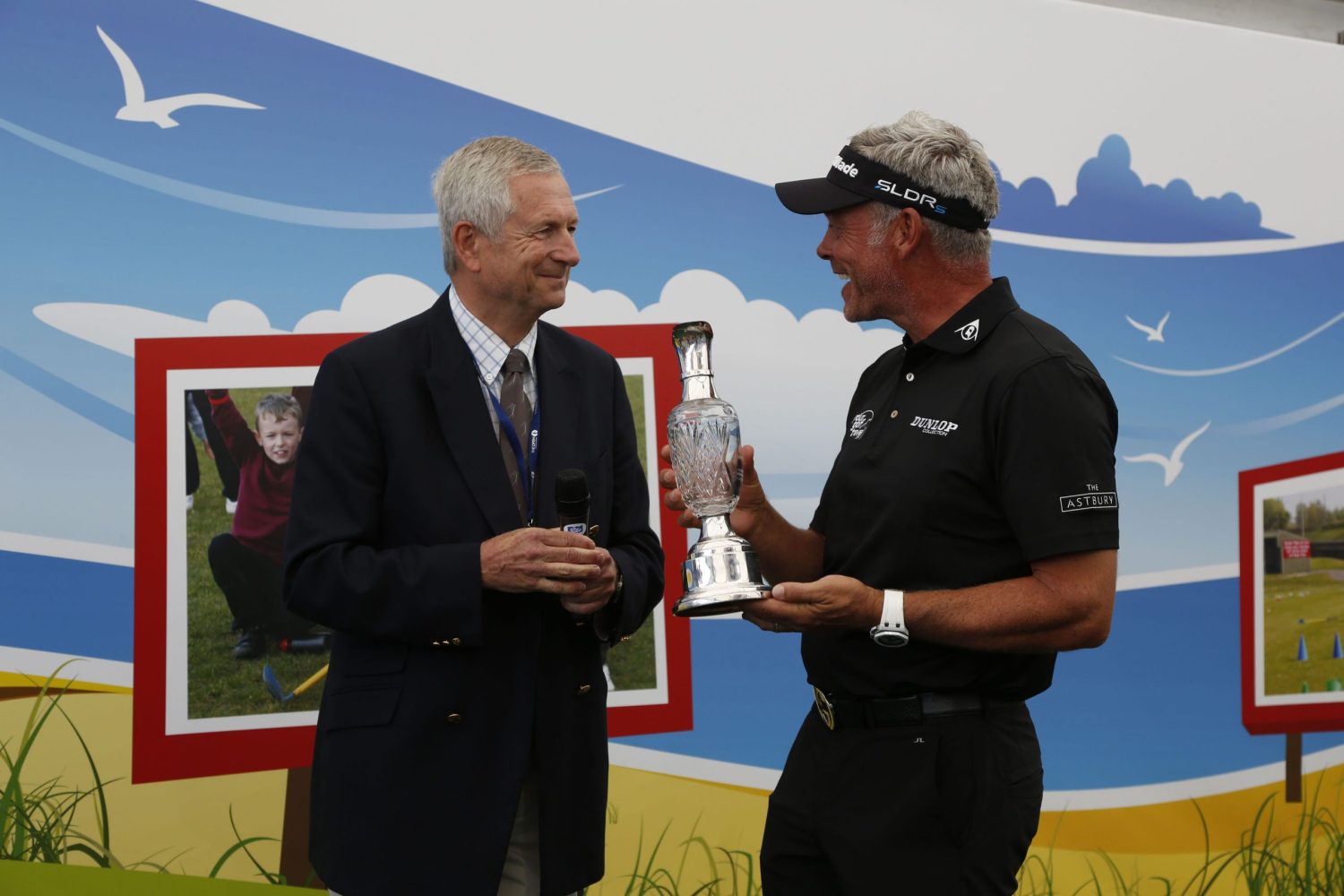 Darren Clarke receives Spirit of Golf Award from Charles Harrison