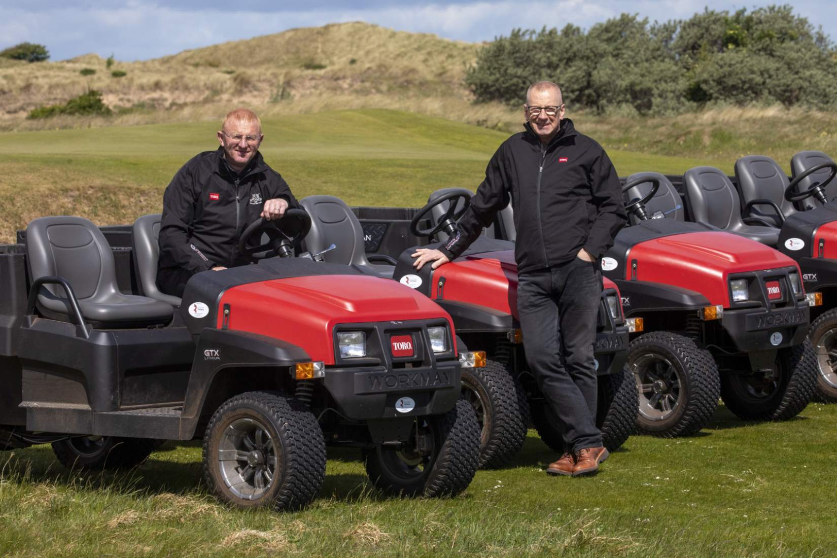 Gullane’s course manager Stewart Duff (left) and Reesink Turfcare rep Neil Mackenzie with the club’s new five Toro Workman GTX Lithium-Ion utility vehicles