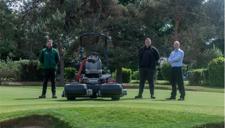 From left: course manager Ryan Bezzant, Reesink’s Tom Clark and Fulwell’s director of golf Peter Hall standing on a green next to the club’s brand new Greensmaster eTriFlex 3370.