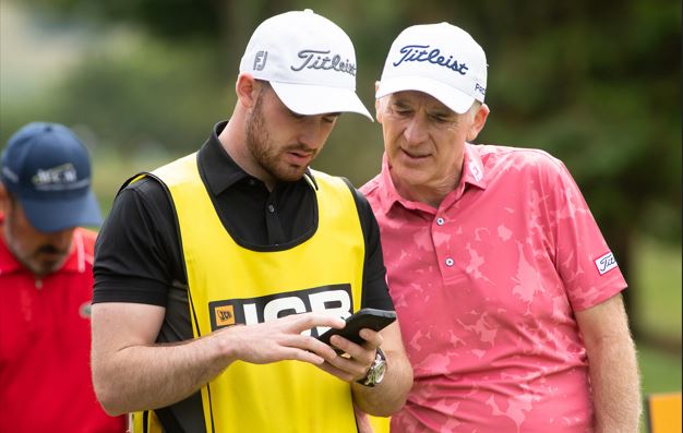 Phillip Price and his son consult their SkyCaddie on the 10th tee during the JCB Championship (photo Andy Hiseman)