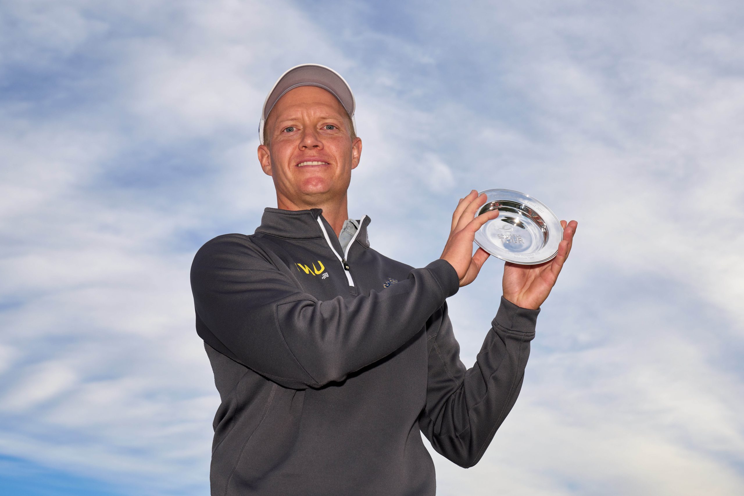 Simon Forsstrom of Sweden poses with the trophy after victory during Day Six of the Final Stage of Qualifying School at Lakes Course, Infinitum   (Photo by Angel Martinez/Getty Images)