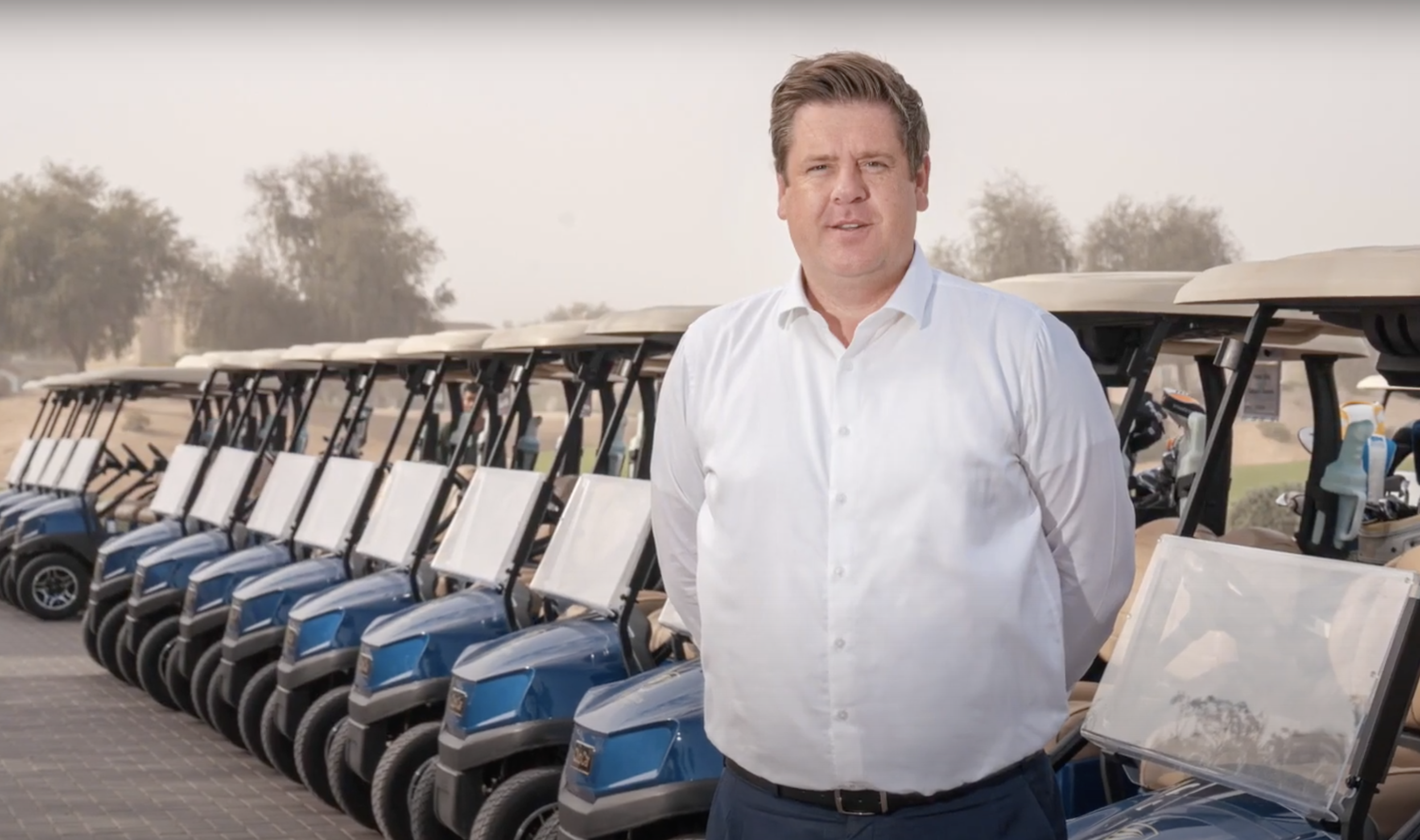 Tom Rourke, General Manager of The Els Club Dubai, with the venue's fleet of Club Car buggies