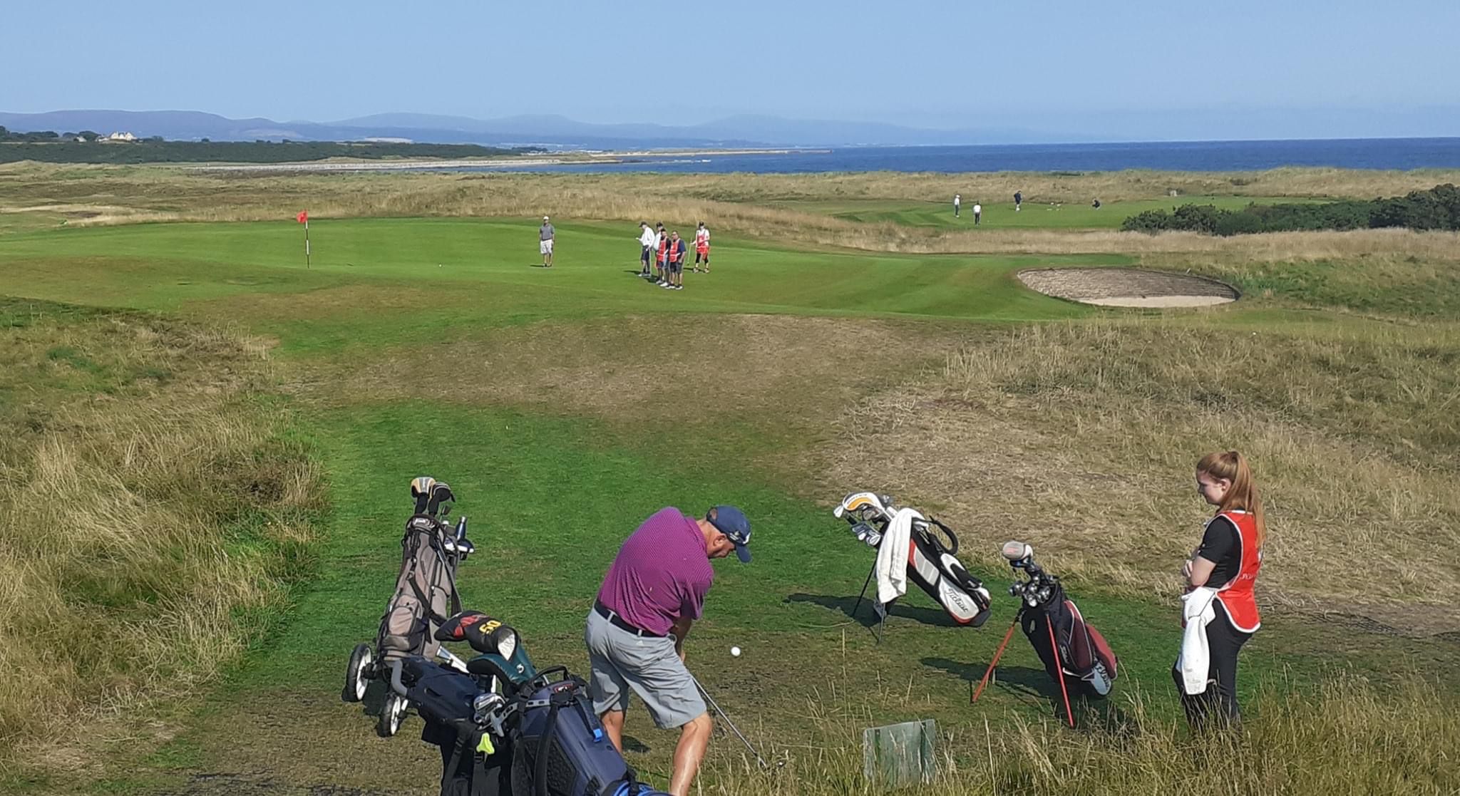 Hannah Riddell caddying at 17th Royal Dornoch