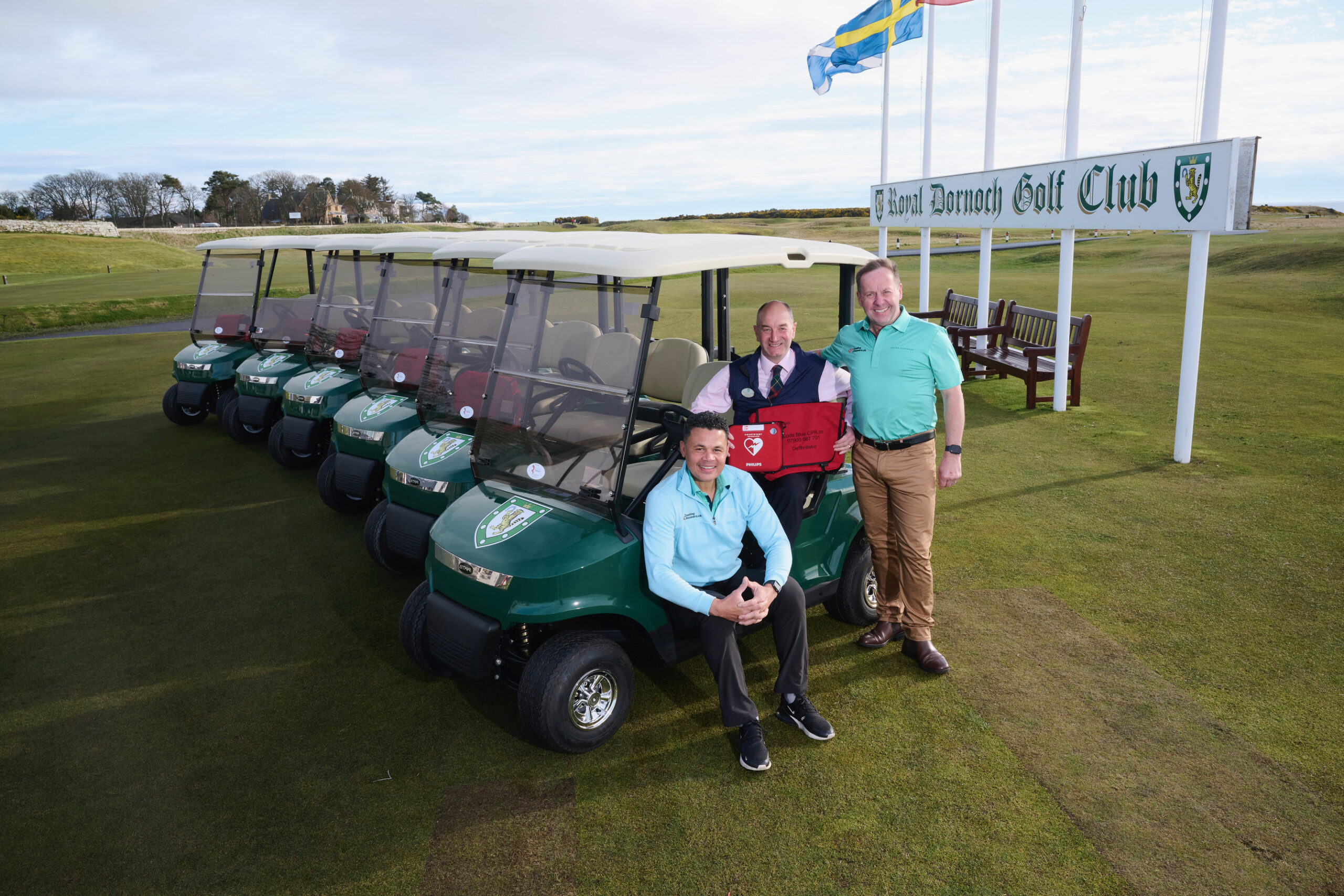 Royal Dornoch general manager Neil Hampton (centre) welcomes the installation of buggy defibrillators with CPR campaigners, former England footballer John Salako (left) and David Sullivan 