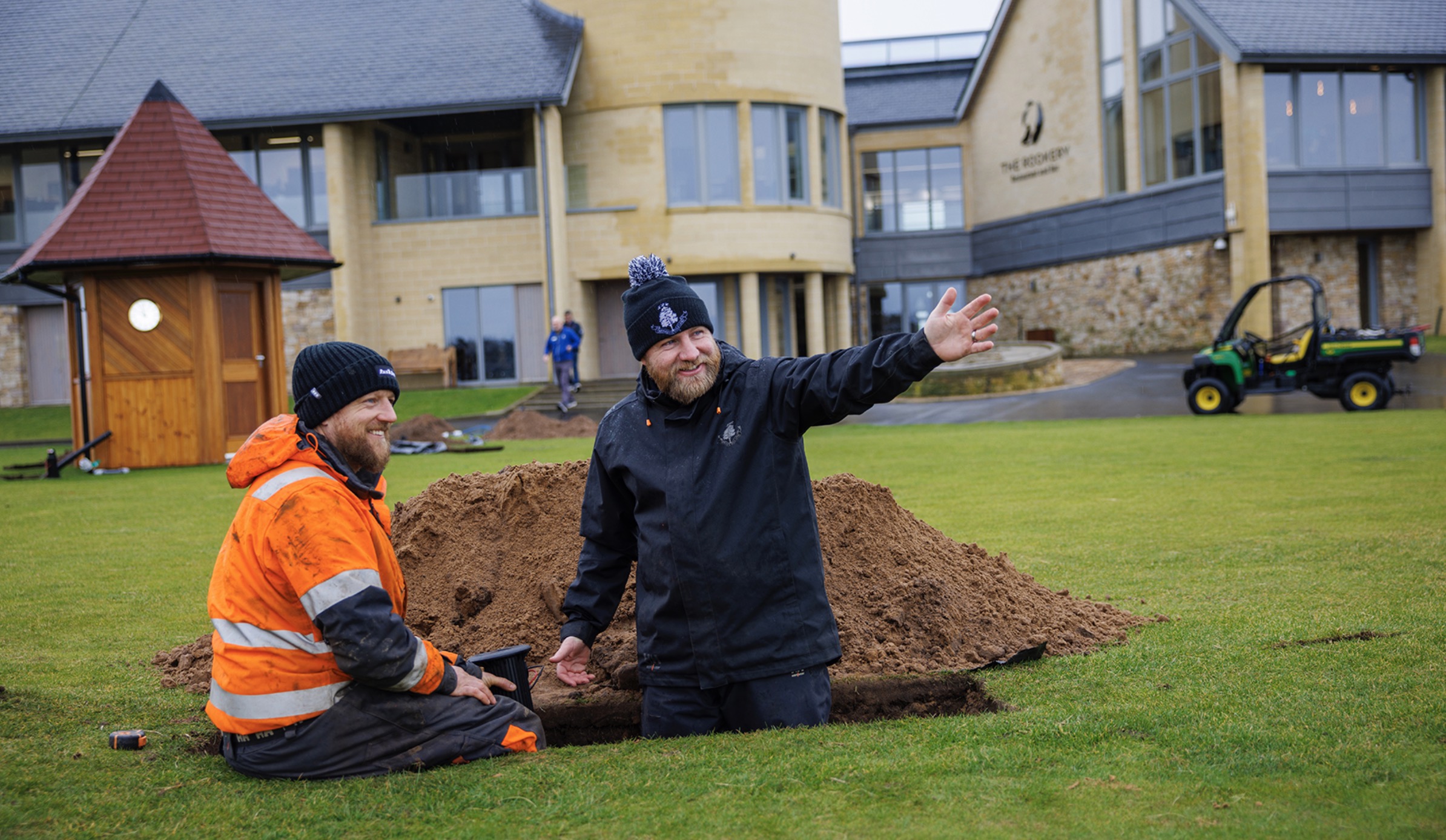 Irrigation Technician Stephen Sutherland (R) overseeing the installation of rotors on the Championship Course