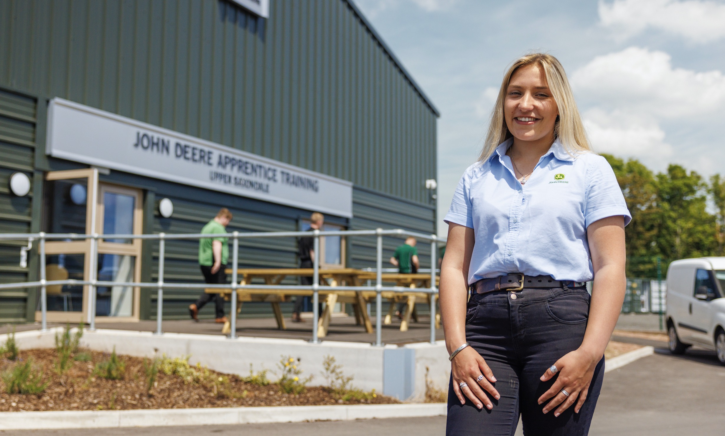 Honor Miles, apprentice technician, stood outside the John Deere Apprentice Training Centre
